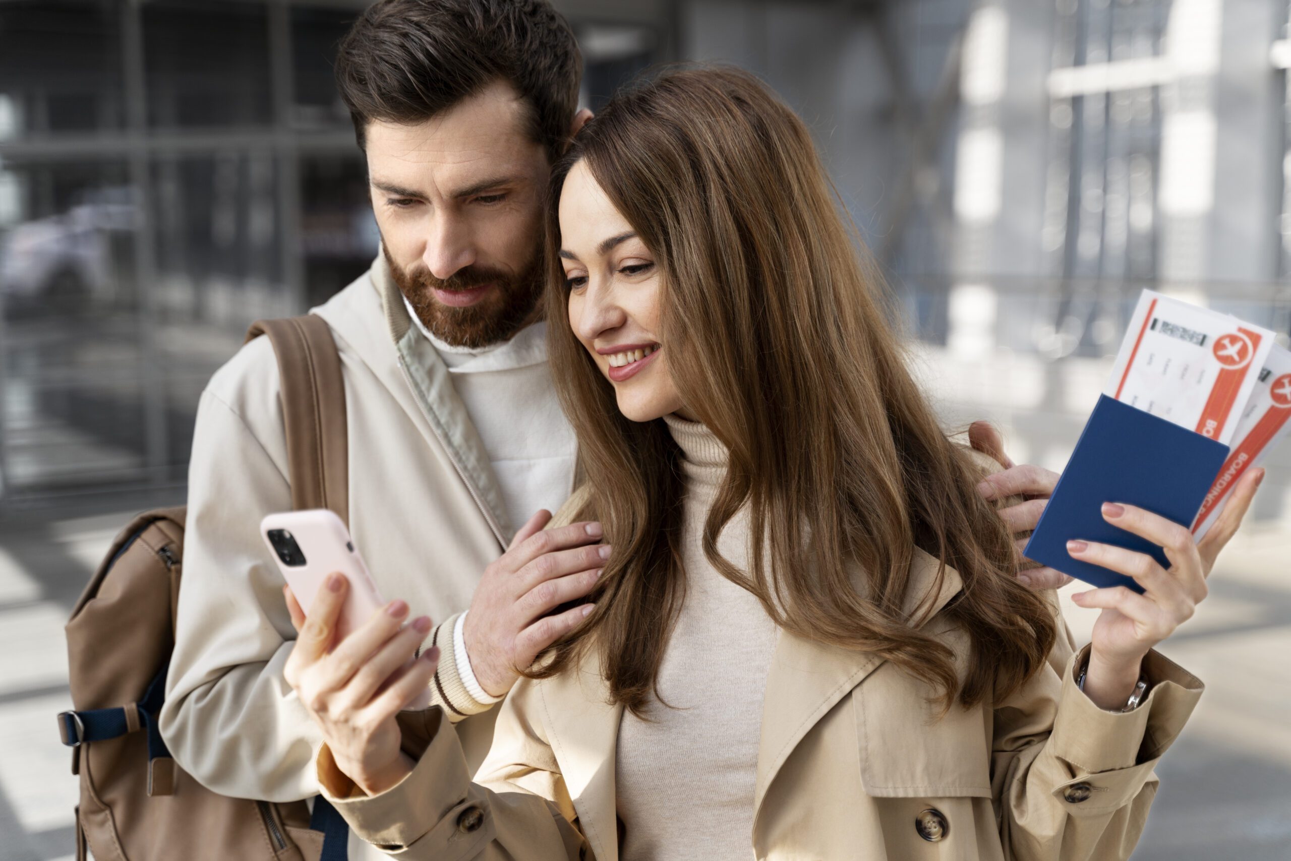 medium-shot-couple-looking-phone best tourist visa consultants in Hyderabad